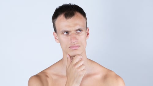 Shirtless Man Thinking with Hand on Chin