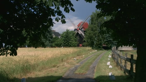 Windmill At Sunny Cloudy Weather