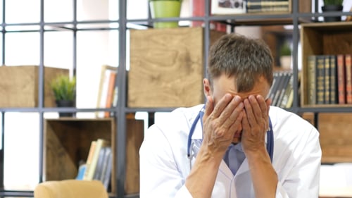 Tired Doctor at Work