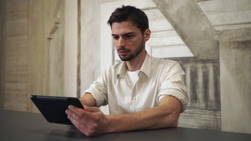 Businessman Holding Gadget And Use Internet In The Office.
