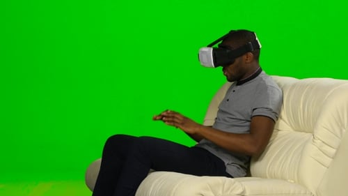 Man In Awe Of The Movie The Mask Of Virtual Reality. Green Screen