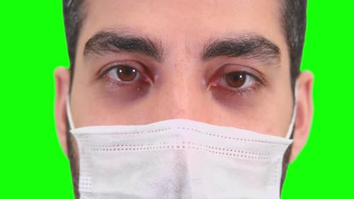 Man Wearing Mask Against Green Screen Close Up