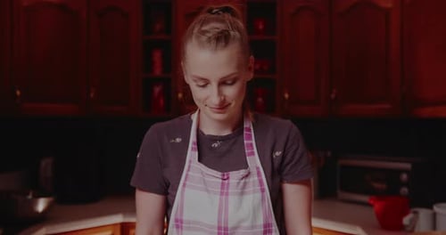 Woman Smiling in a Home Kitchen