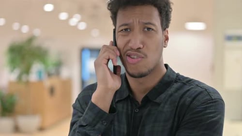 Young Adult Talking on Cellphone Close Up