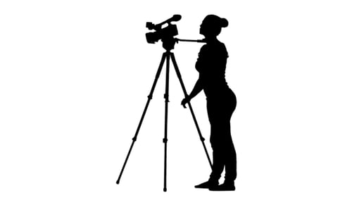 Woman Adjusting Video Camera Silhouette on White