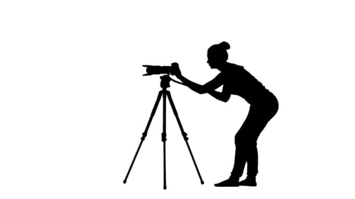 Operator Works With The Camera On Tripod, At Waist Level
