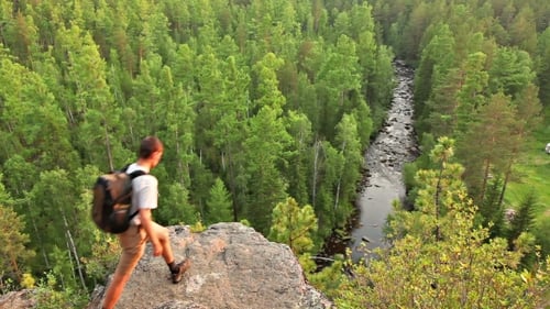 Hikers Admire Forest and River View