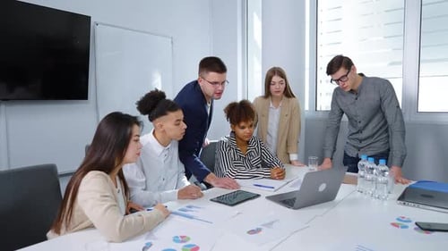 Diverse Business Team Collaborates in Modern Office