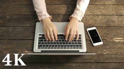 Typing on Laptop Computer Overhead Close Up