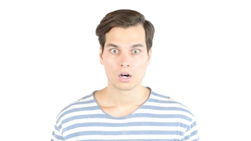 Man Reacts with Surprise Covering Mouth