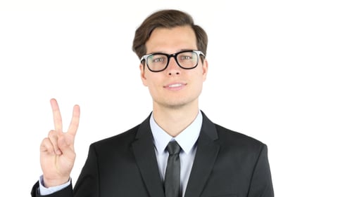 Young Man in Suit Gives Peace Sign