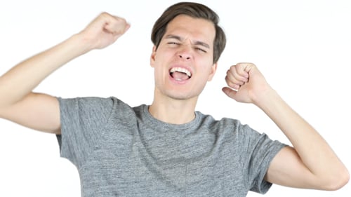 Excited Man Celebrates Success with Fists