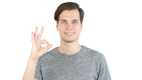 Young Man Gives "Okay" Hand Gesture
