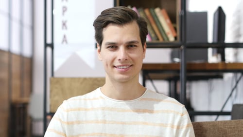 Smiling Young Man Portrait in Home Interior