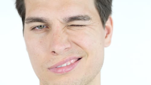 Young Adult Winking One Eye at a Time