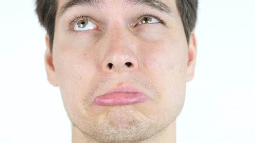 Young Adult Making a Sad Face Close Up