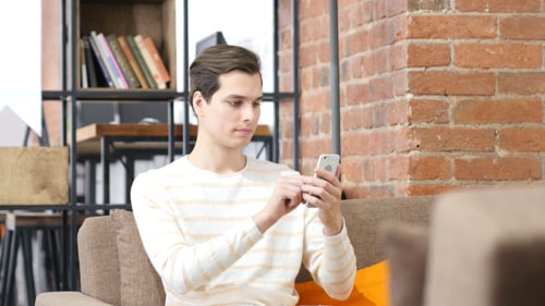 Designer Using Smartphone