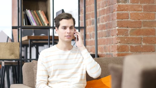Man Attending Phone Call and Talking