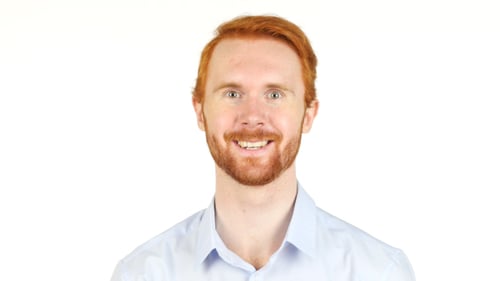 Smiling Man with Red Hair on White Background