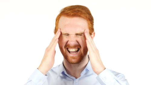 Man Massaging Temples to Relieve Headache Pain