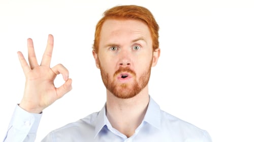 Man Makes Ok Hand Gesture with Bright Background