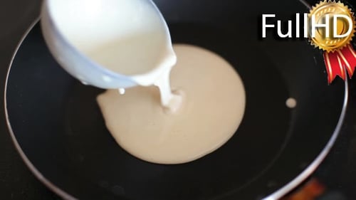 Delicious Pancake Cooking in a Frying Pan
