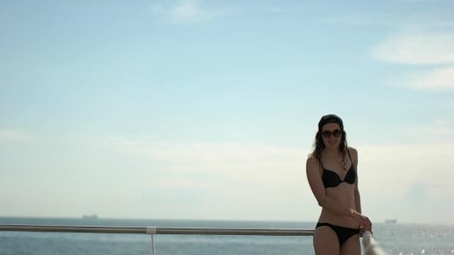 Girl In Swimsuit At The Sea