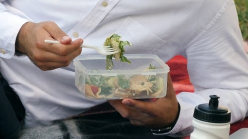 Businessman In The Garden Eating Lunch