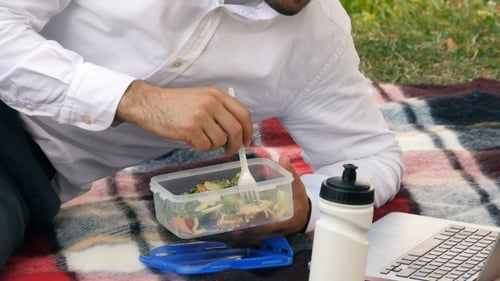 Businessman Wsiting On Green Grass, Eating Lunch,