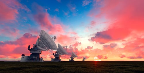 Radio Telescopes Scanning Under Dramatic Sunset Sky