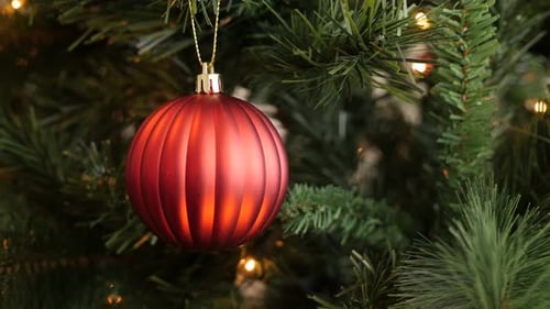 Close-up of detailed red Christmas tree decoration 4K 2160p 30fps UltraHD footage - Decorative bau