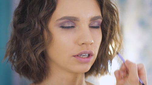 Woman Getting Eyeshadow Applied for Beauty and Fashion