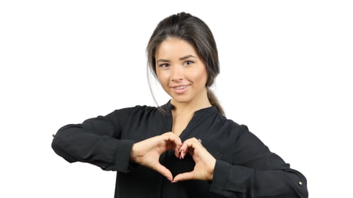 Woman Makes Heart Shape With Hands
