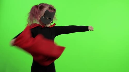 Child with Cape and Mask on Green Screen