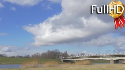 Truck Crossing Bridge on Sunny Day