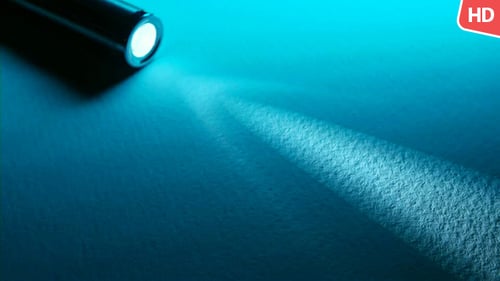 Flashlight Beam on Cyan Surface Illuminating Texture