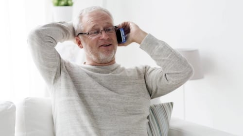 Senior Man Chatting on the Phone at Home