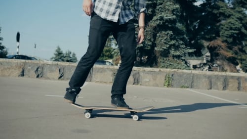 Young Adult Performing Skateboard Ollie in Urban Setting