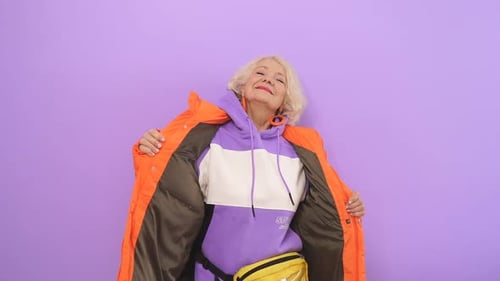 Stylish Elderly Woman Models Colorful Fashion