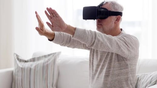 Man Using Virtual Reality Headset on Couch