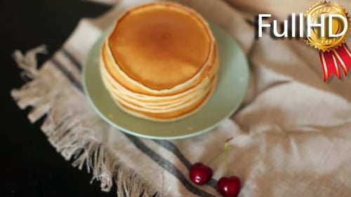 Pancake Stack with Cherries on Kitchen Table