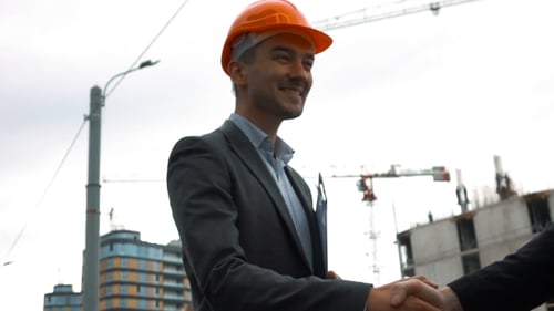 Two Builders Are Shaking Hands