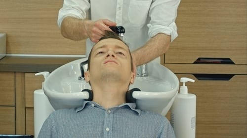 Man Receiving a Hair Wash at Hair Salon