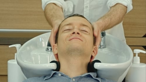 Man Gets Hair Washed at the Salon