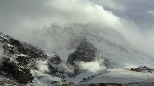 Snowy Mountains and Mist in Winter Landscape