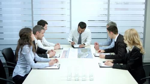 Diverse Business Team Celebrates Success in Modern Office