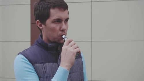 Man Smoke Electronic Cigarette Outdoor