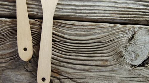 Wooden Kitchen Utensils on Weathered Wood Surface