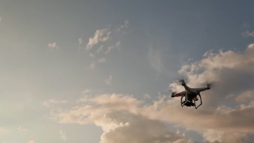 Drone With Camera Flying On Sunset. Fast Shooting.