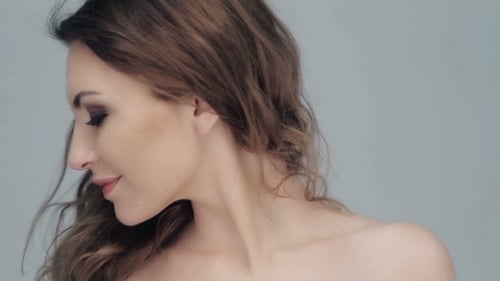 Beautiful Woman Posing with Bare Shoulder